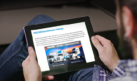 Person reading Kenworth news on tablet